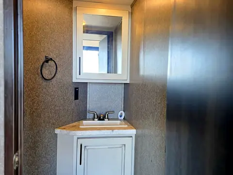 Half bathroom with toilet and small sink
